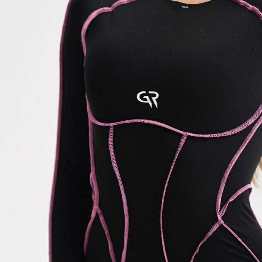 Black athletic outfit with pink accents and a logo on a white background