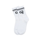 White sock with black logo on a brown background