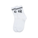 White sock with black logo on a brown background